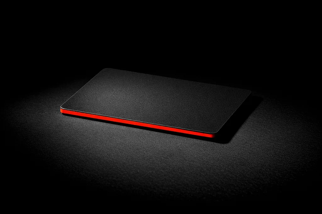 Plain bank card seen edge on with a vermillion edge stripe, payment method for welcome bonus deposit