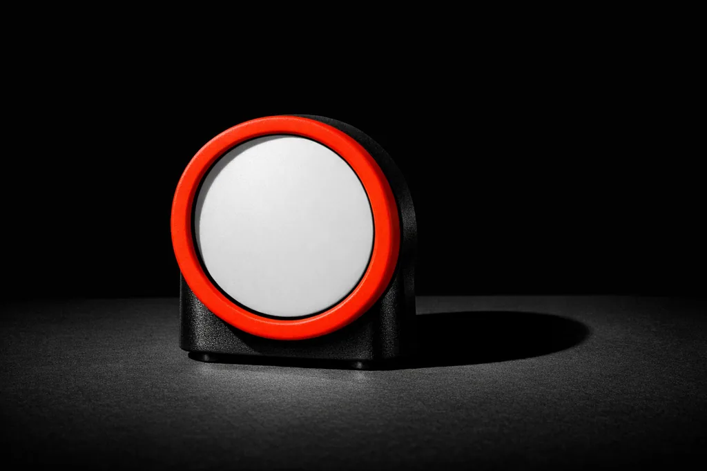 Mechanical timer with matte vermillion bezel representing the welcome bonus expiry window
